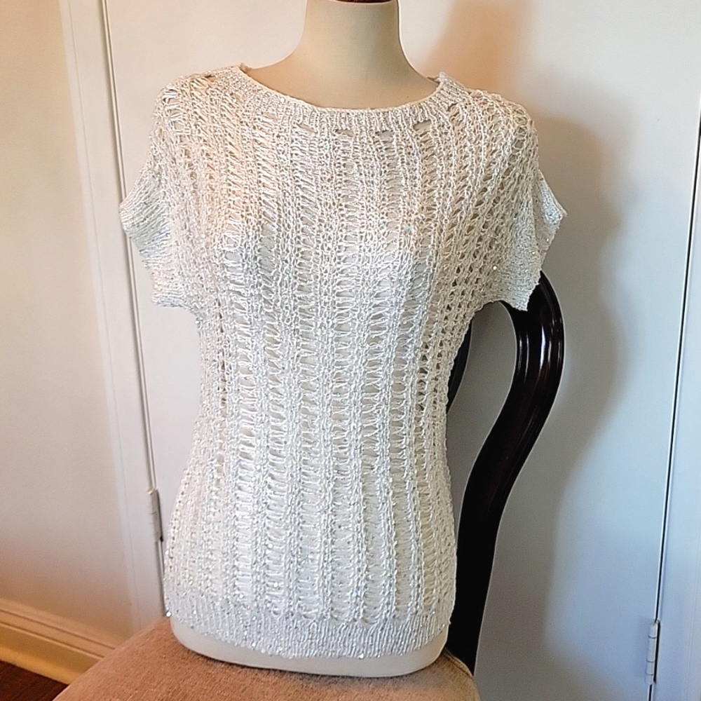 A beaded blouse . It's brand new but doesn't have tag .